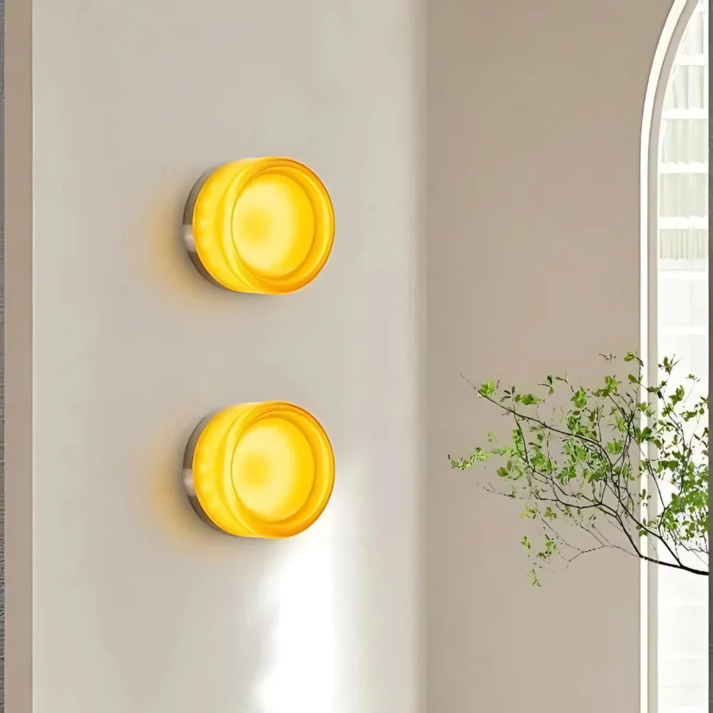 Wall lamp with sculptural glass shade and integrated dusk-to-dawn LED sensor, minimalist modern style