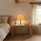 Mushroom table lamp with warm amber glow, cast iron frame and hand-blown glass shade